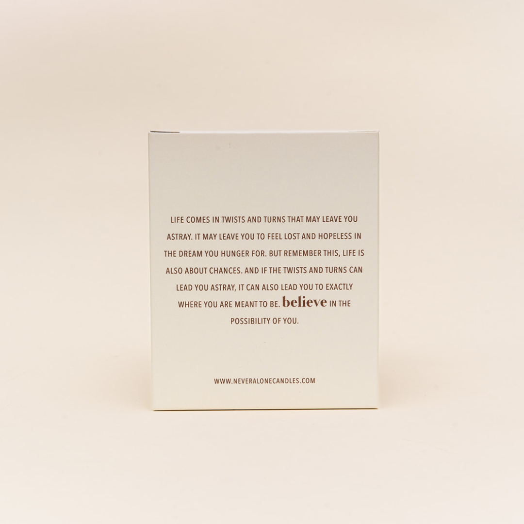 Scented candle with white box and inspirational message about believing in yourself