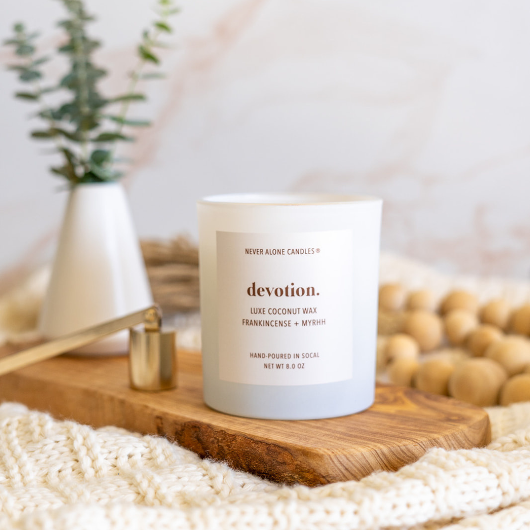 A headache free candle made with coconut wax crackling wood wick and scented with frankincense and myrrh for neutral home decor