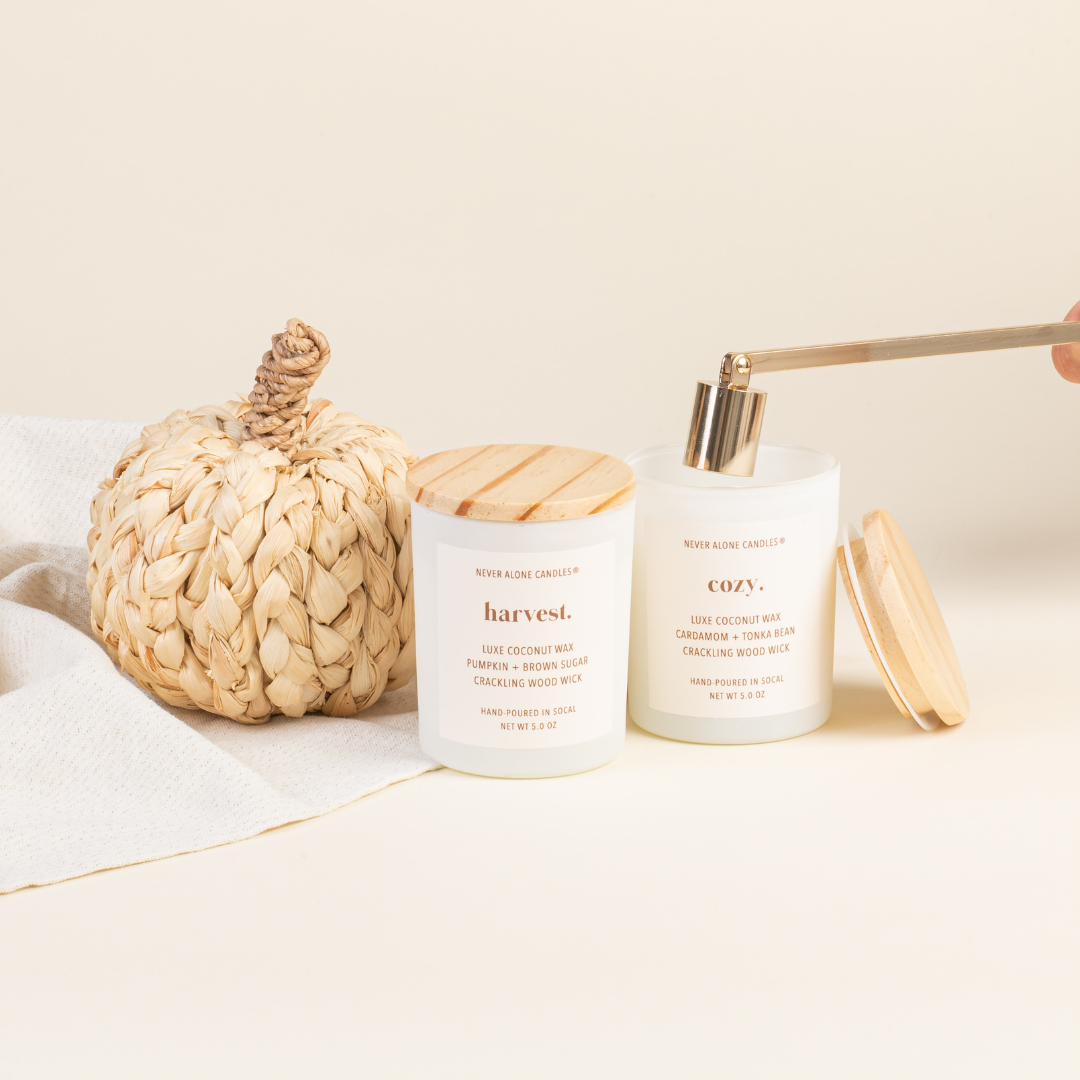 A coconut wax candle and crackling wood wick and a blend of cardamom and tonka bean