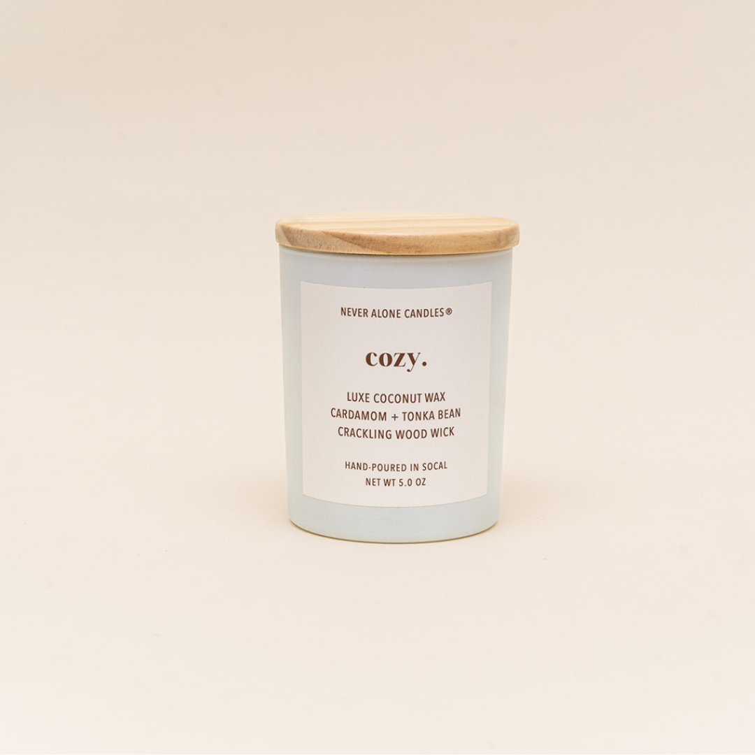 Eco-friendly luxury candle made with natural coconut wax, hand-poured in small batches, featuring a long-lasting crackling wood wick and a fragrant blend of cardamom and tonka bean