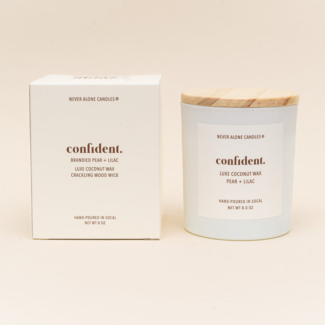 Hand-poured coconut wax candle with a crackling wood wick, scented with brandied pear and French lilac.