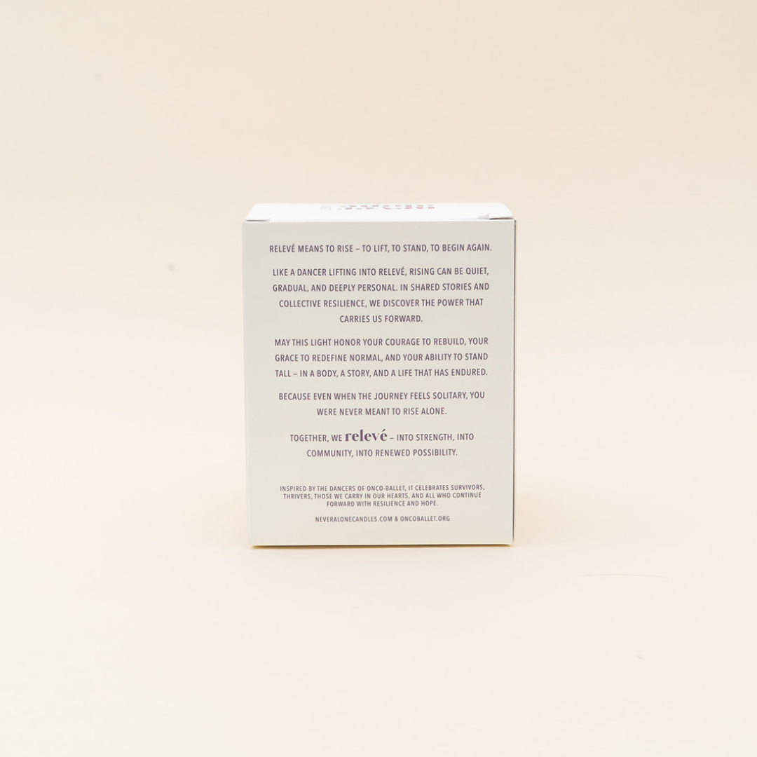 The back of a white square box with black printed text, photographed against a plain warm off-white background.