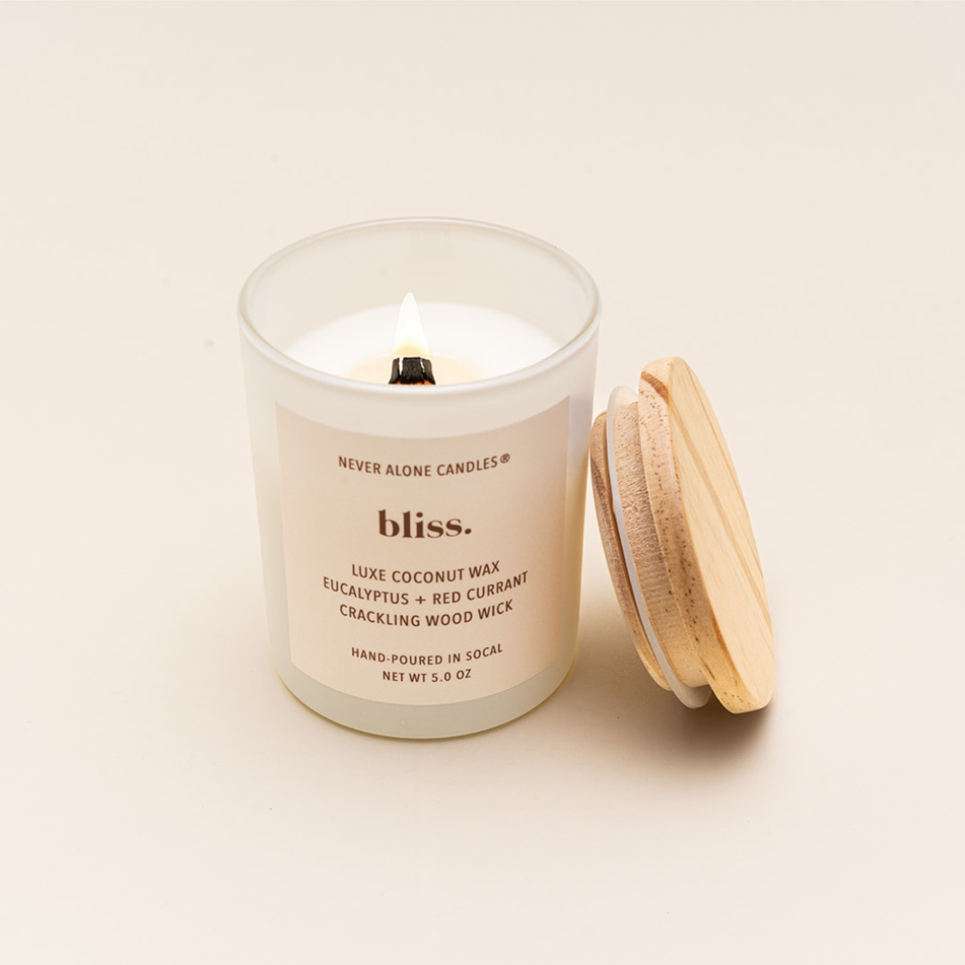 Luxury eco-friendly candle crafted from natural coconut wax, hand-poured in artisanal small batches, with a soothing crackling wood wick, fragrances eucalyptus and red currant