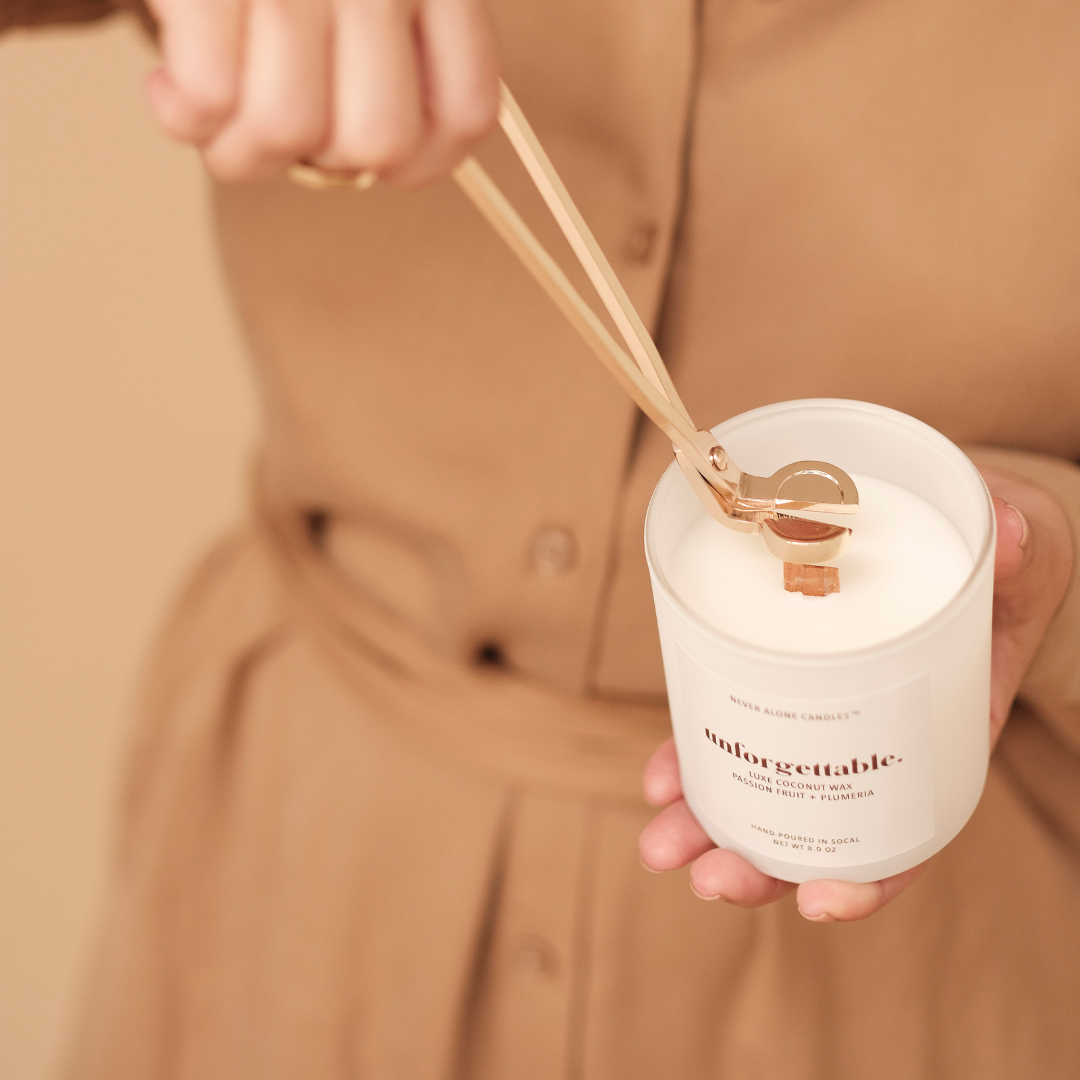 gold wick cutter engraved with Never Alone Candles